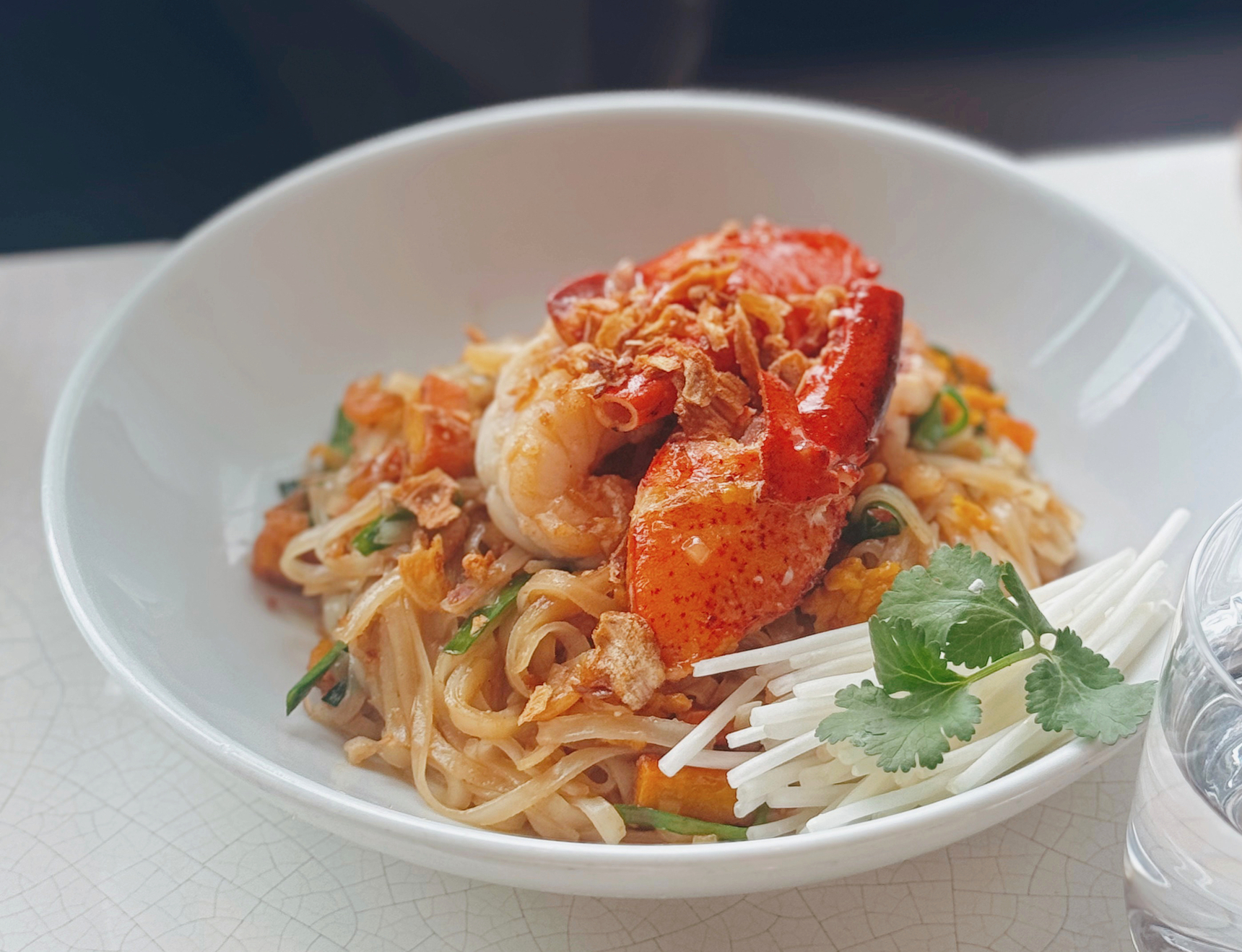Lobster Pad Thai, Boston lobster, flat rice noodles, tamarind sauce, peanuts. This photo is courtesy of Grand Cafe, Grand Hyatt Hong Kong. 